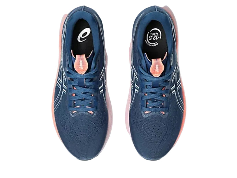 Blue running shoes with pink accents on a white background