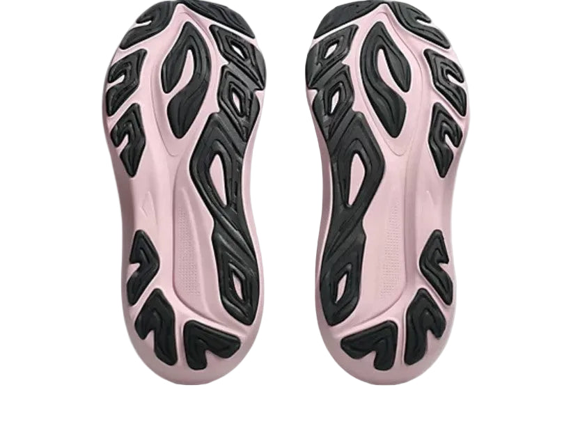 Pink athletic shoes with black patterned sole on a light gray background