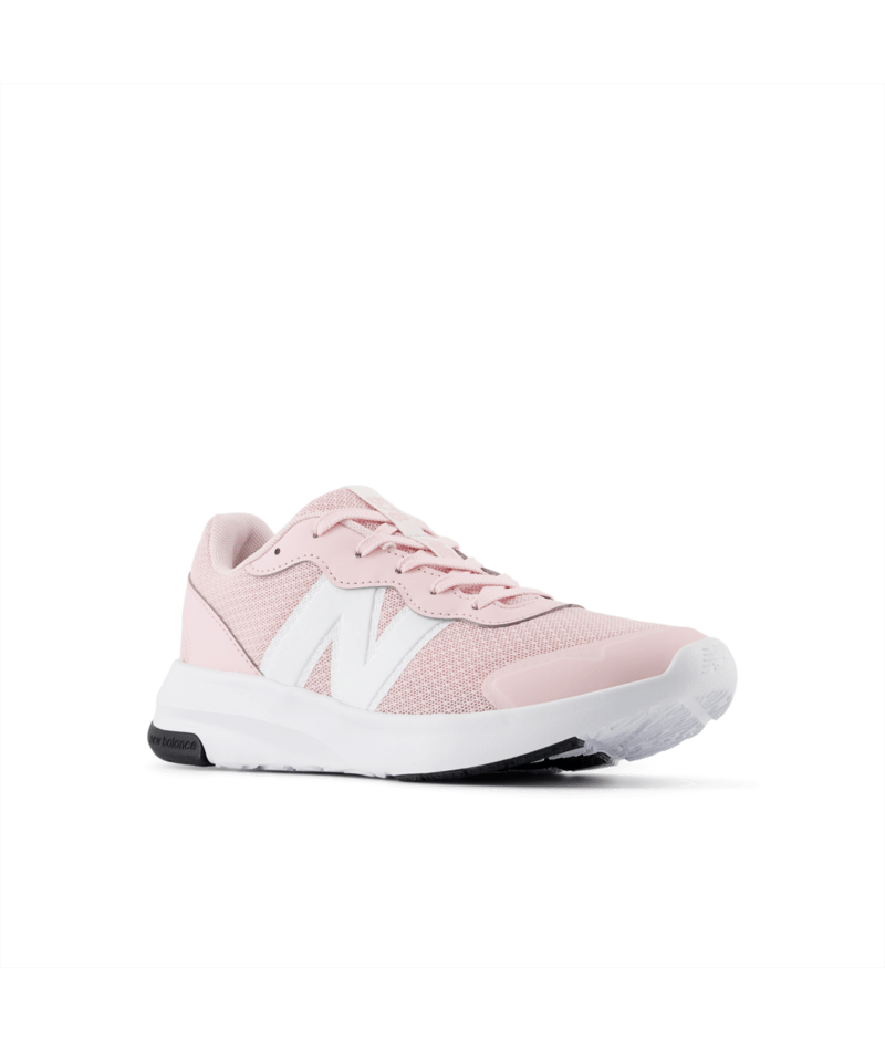 Pink sneaker with white sole on a light gray background
