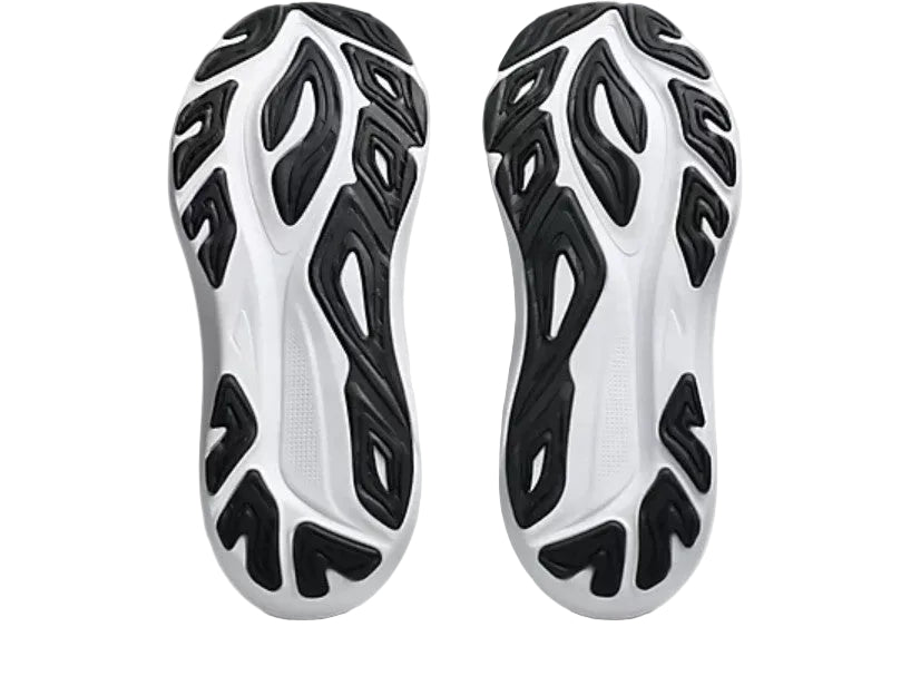 White and black sneaker soles with a unique pattern on a white background