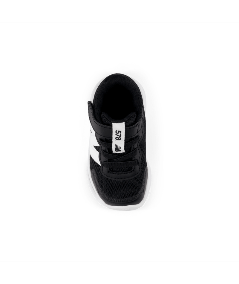 Black sneaker with white accents on a white background