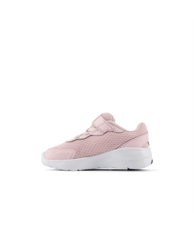 Pink sneaker with a white sole on a white background