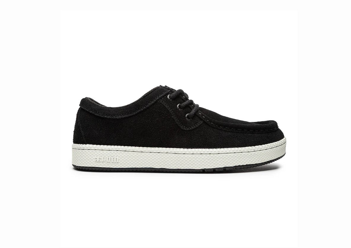 Black sneaker with white sole on a white background