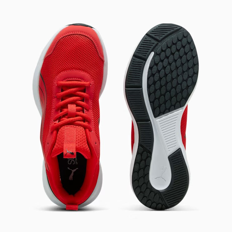 Red athletic shoe with black sole on a white background
