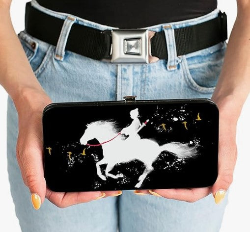 Person holding a wallet with a horse and rider design on a black background