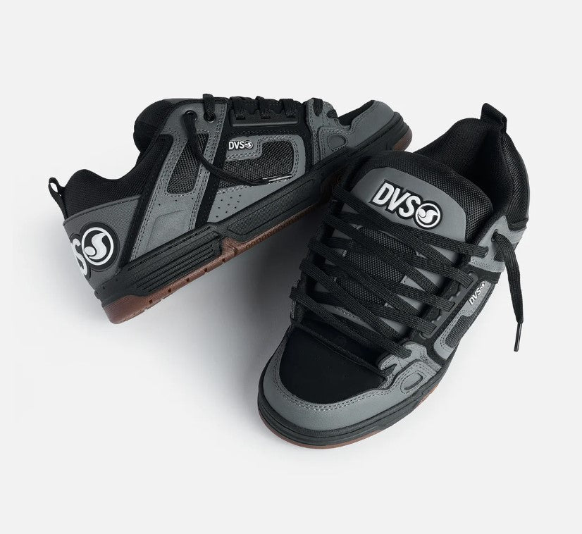Pair of black and gray sneakers with DVS logo on a white background