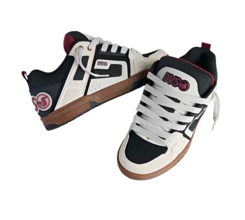 Pair of black, white, and brown sneakers with visible DVS branding on a white background