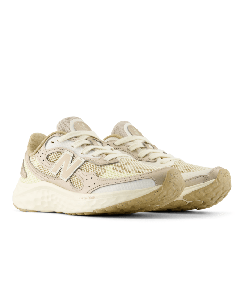 Beige New Balance sneakers on a white background