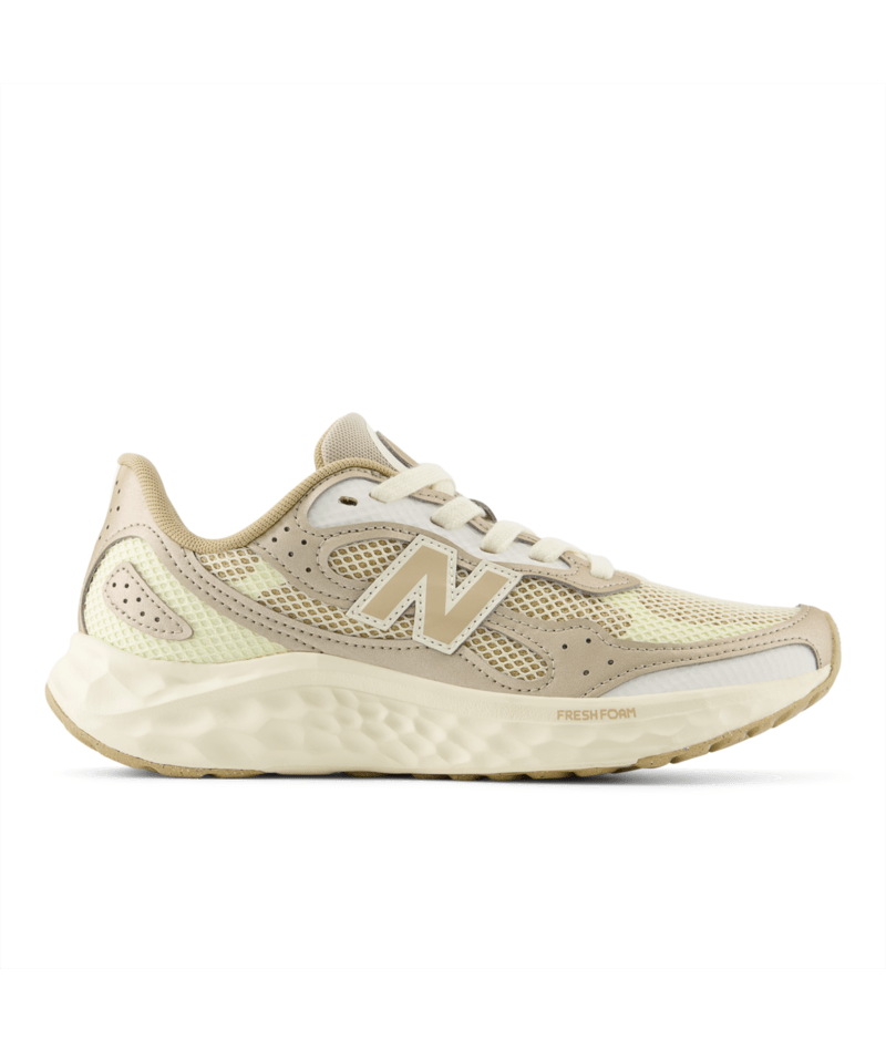 Beige sneaker with New Balance logo on a white background.  Can be purchased at www.sneakersplus.ca