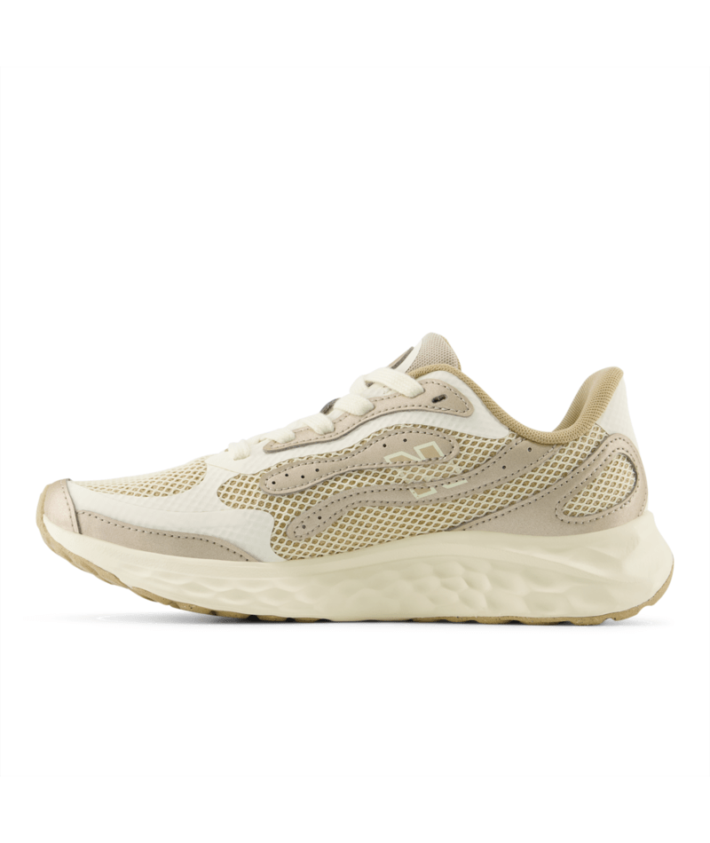 Beige running shoe on a white background