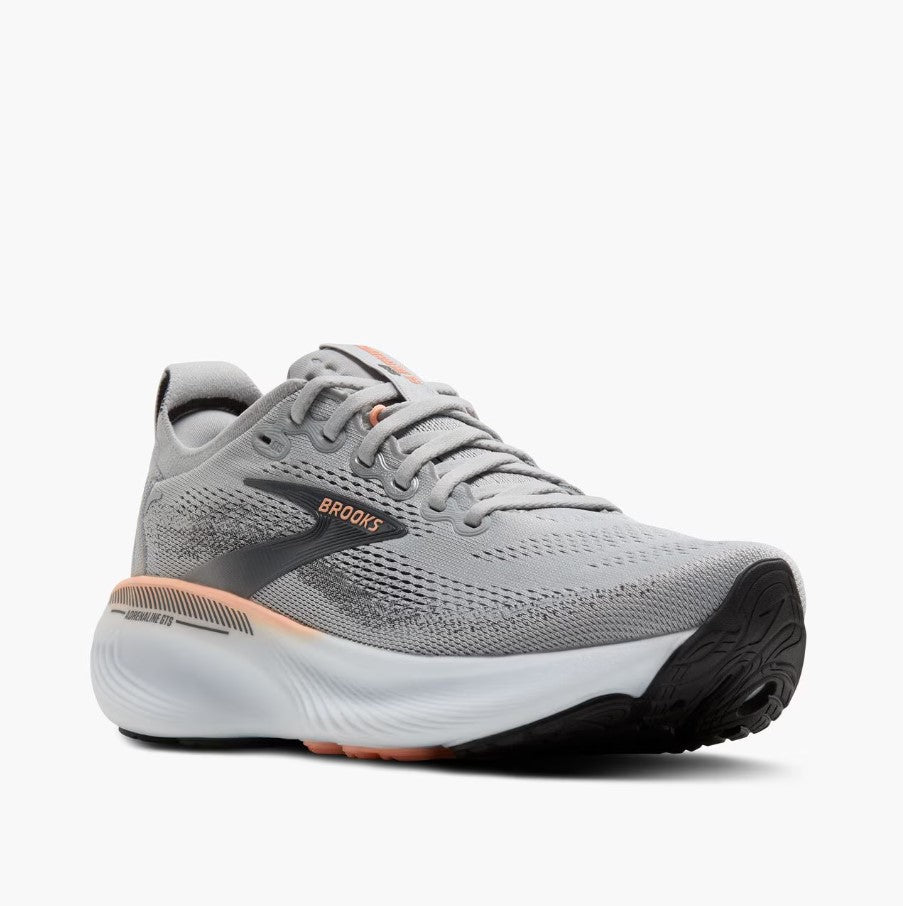 Gray running shoe with black sole on a white background