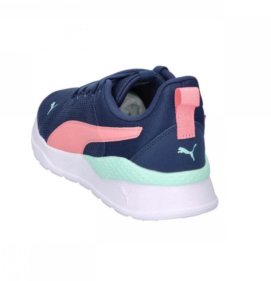 Navy and pink sneaker with a visible brand logo on a white background