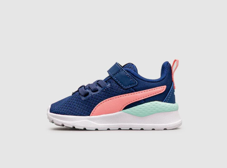 Navy and pink Toddler Puma running shoe on a light gray background