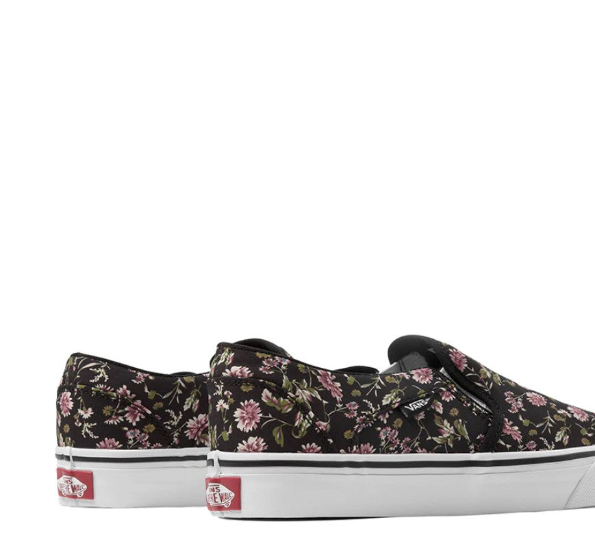 Black floral sneakers with white soles on a white background