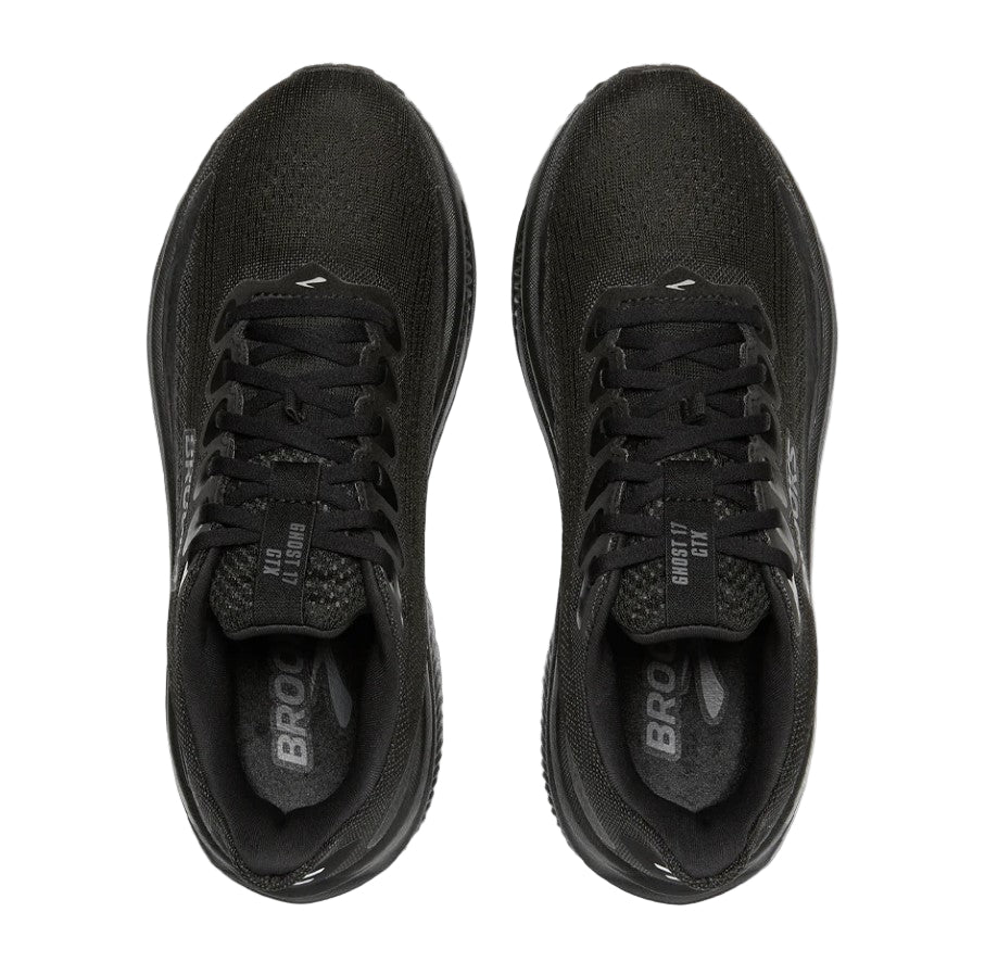 Black running shoes with 'Brooks' branding on a light gray background