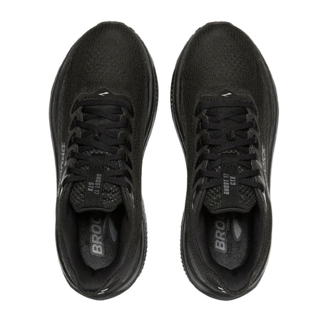 Black running shoes with 'Brooks' branding on a light gray background