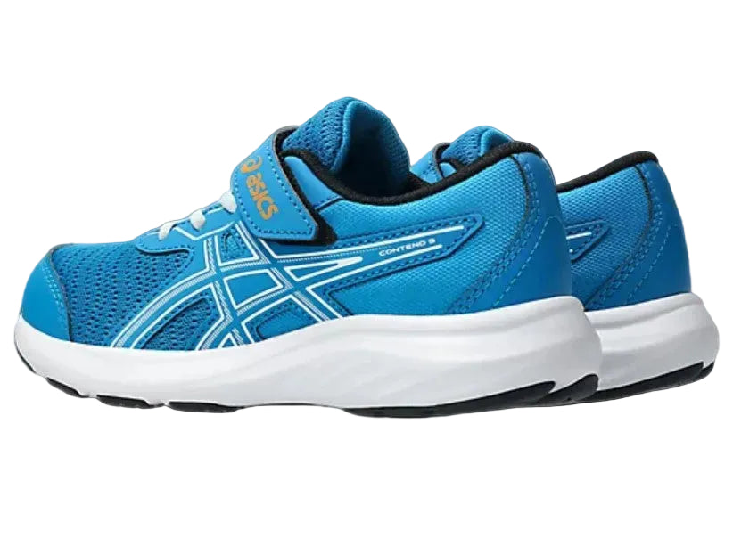 Blue running shoes with white soles on a gray background