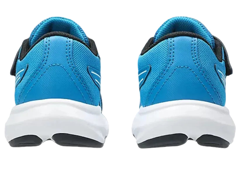 Blue children's shoes with white soles on a gray background
