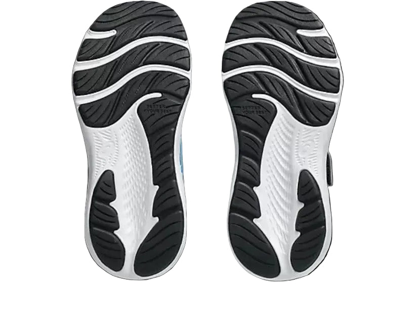 Close-up of black and white shoe soles on a light gray background