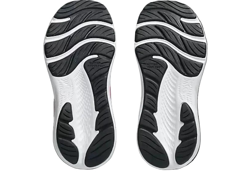 Close-up of black and white shoe soles on a light gray background