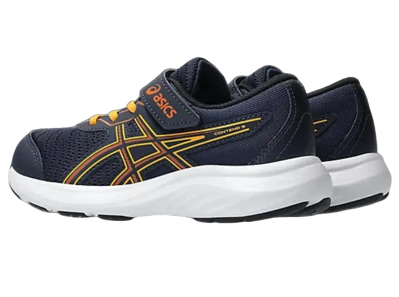 Navy and yellow running shoes with white soles on a light gray background