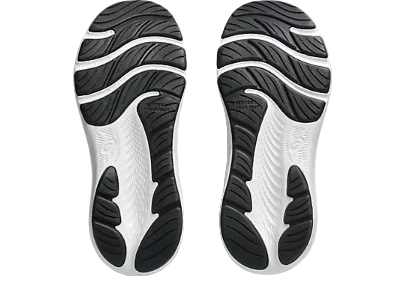 Close-up of a shoe sole with black and white pattern on a light gray background