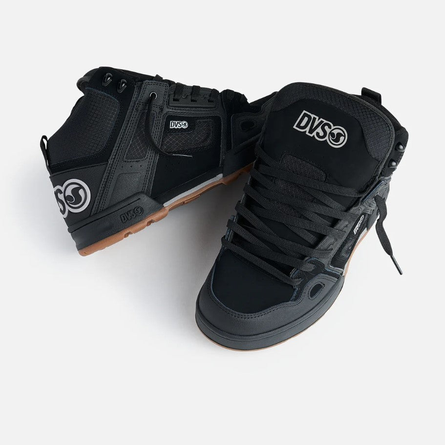 Black high-top sneakers with visible DVS logo on a white background