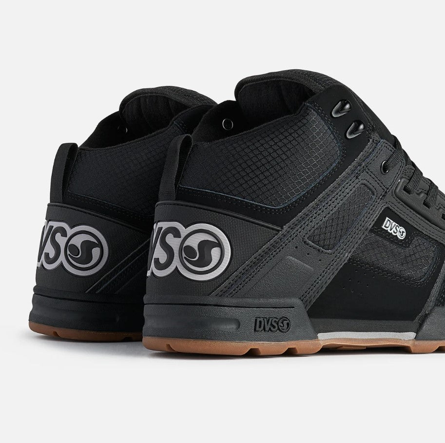 Black and gray sneakers with DVS logo on a light gray background