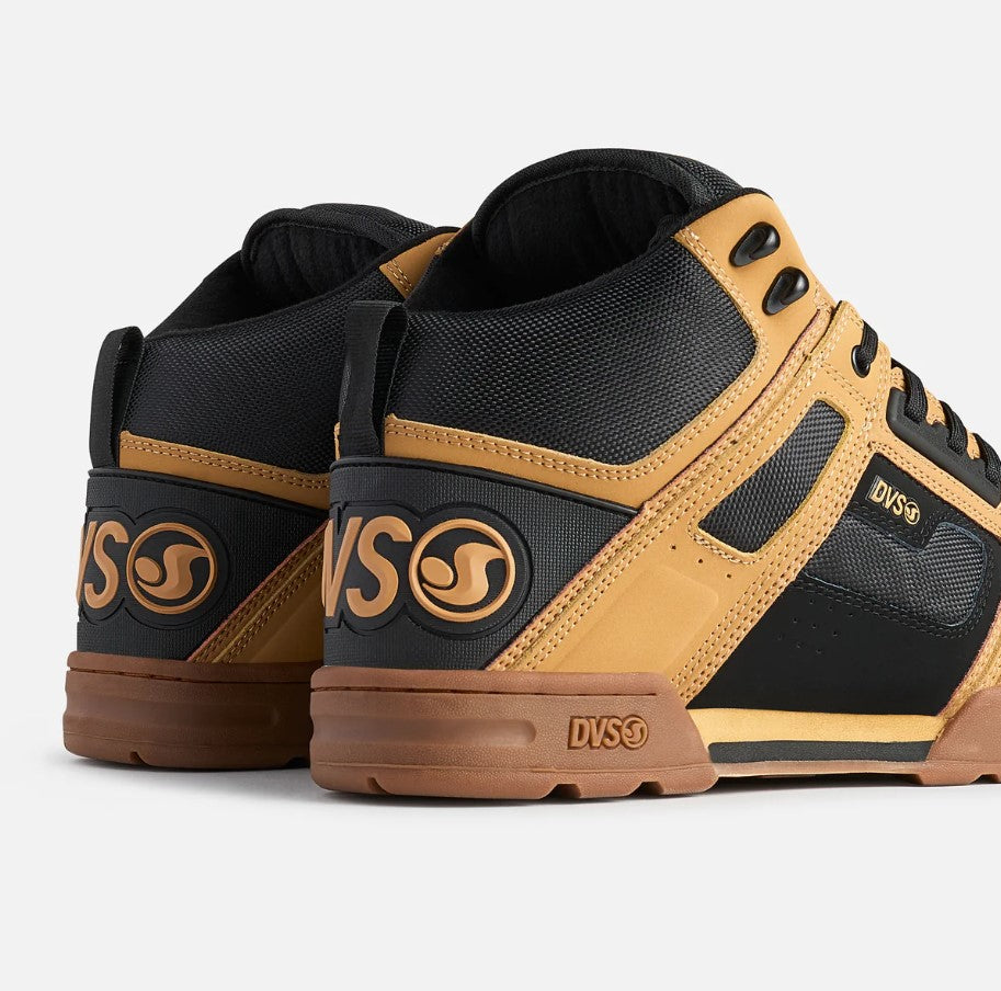 Pair of black and brown sneakers with DVS logo on a white background