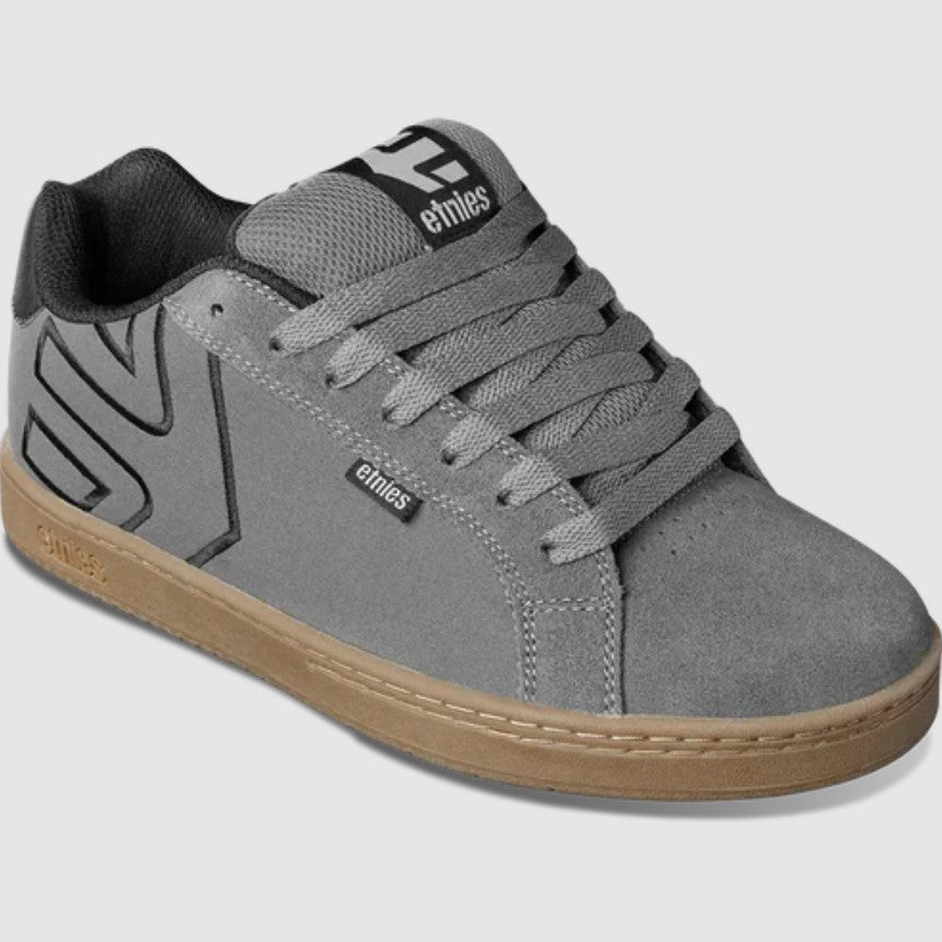 Gray sneaker with brown sole on a white background