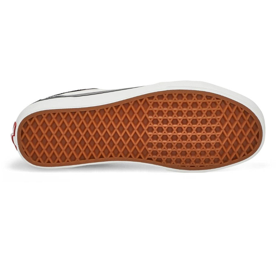 Close-up of a shoe sole with brown pattern on a white background