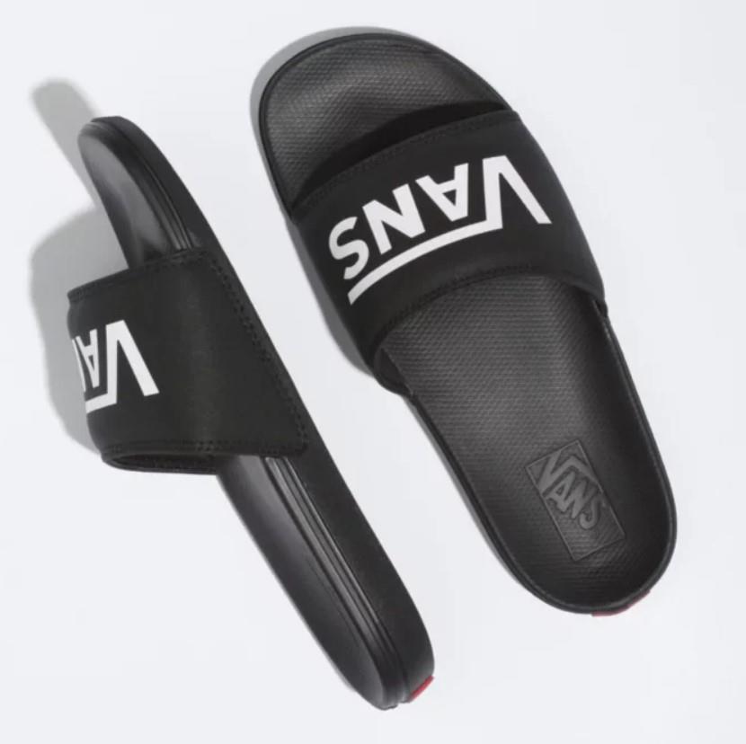Black slides with Vans logo on a white background