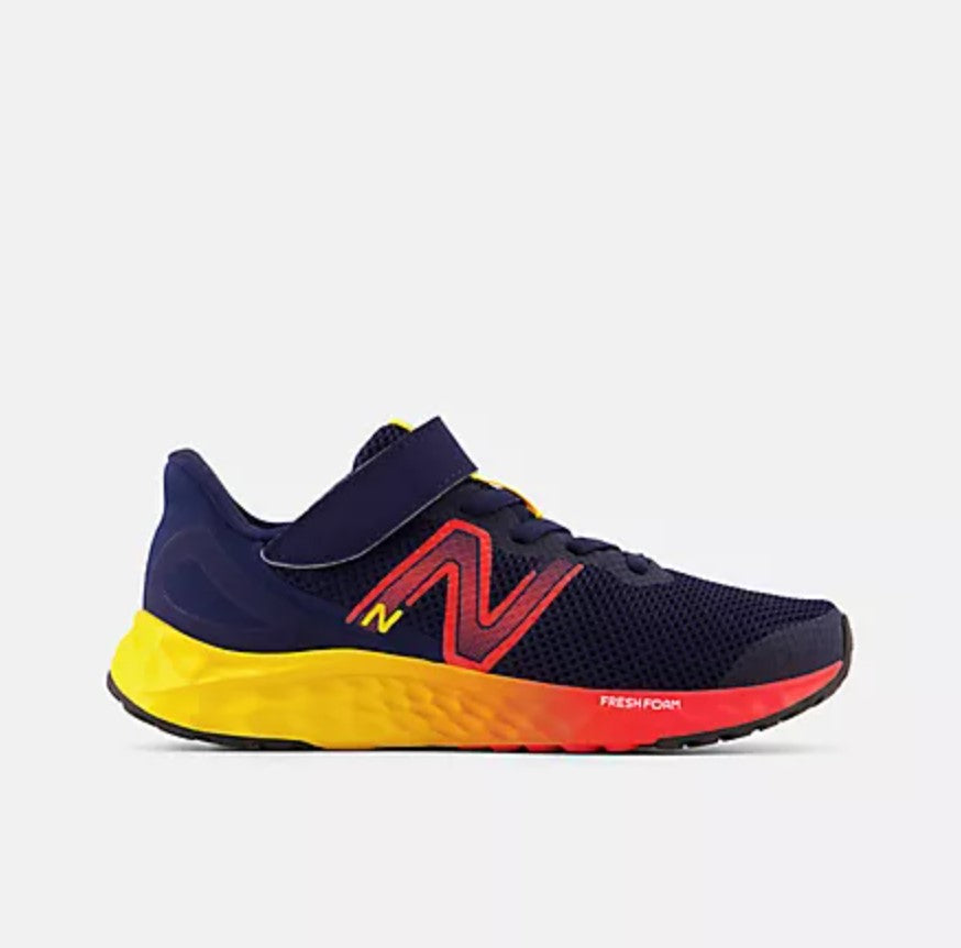 Navy running shoe with red and yellow accents on a light gray background
