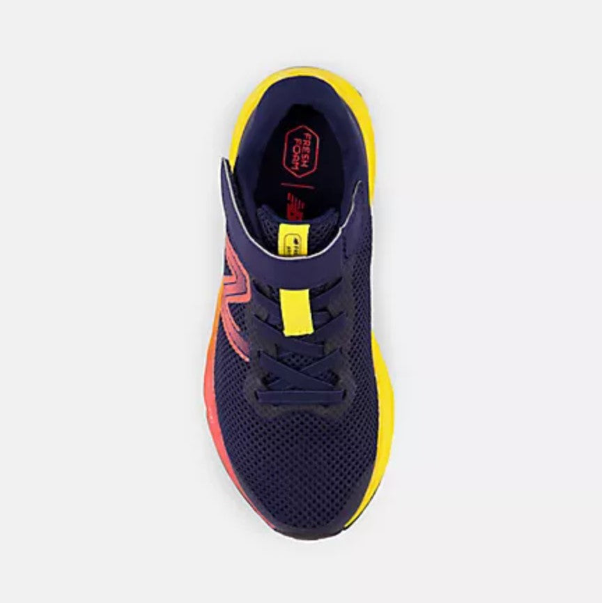 Navy blue athletic shoe with yellow accents on a light gray background