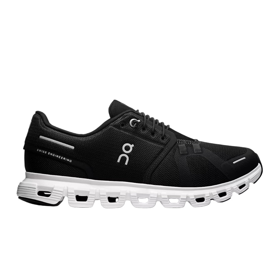 Black running shoe with white sole on a light gray background