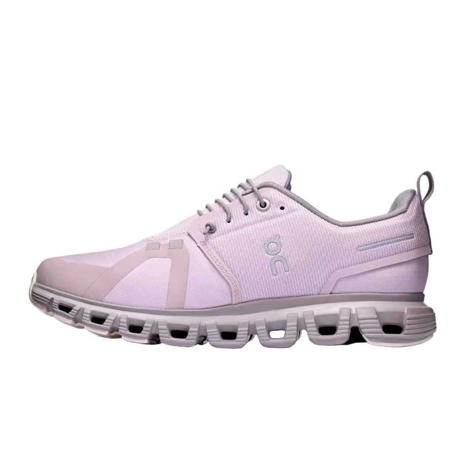 Light purple running shoe with a visible brand logo on a light gray background