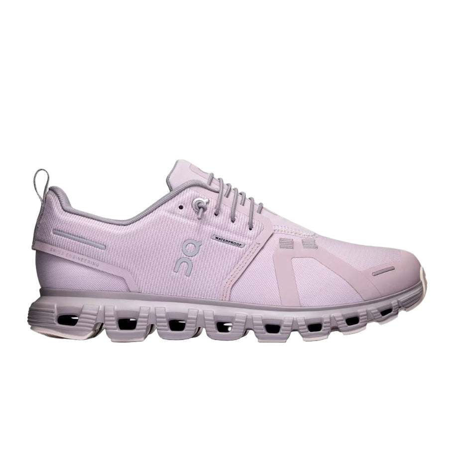 Pink running shoe on a light gray background
