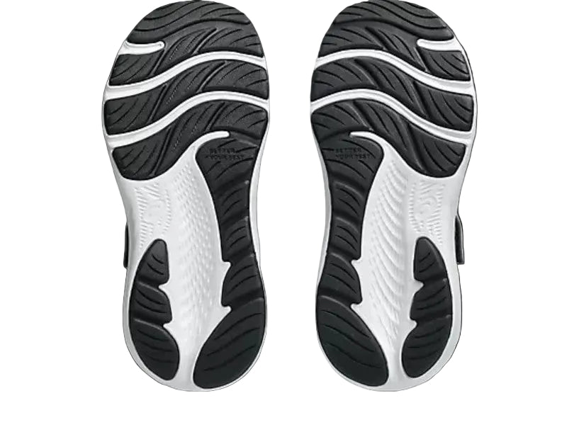 Close-up of the sole of a shoe with black and white tread pattern on a light gray background