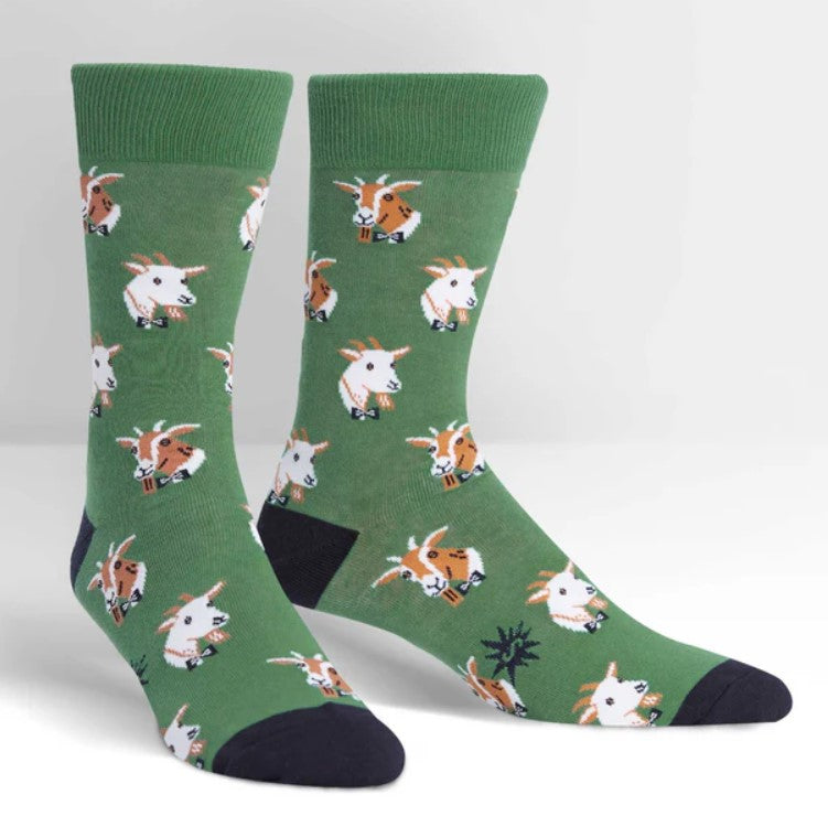 Green socks with a dapper goats pattern on a white background