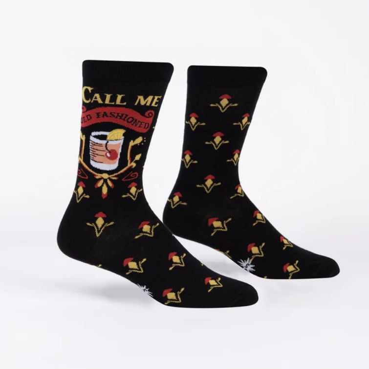 Black socks with red and yellow designs on a white background