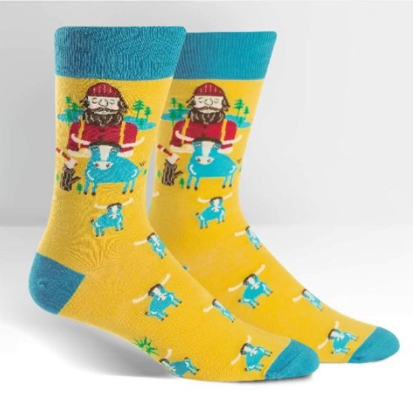 Colorful socks with a design of a man and a cow on a yellow background