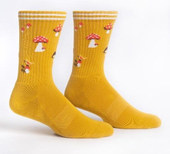 Pair of yellow socks with mushroom pattern on a white background