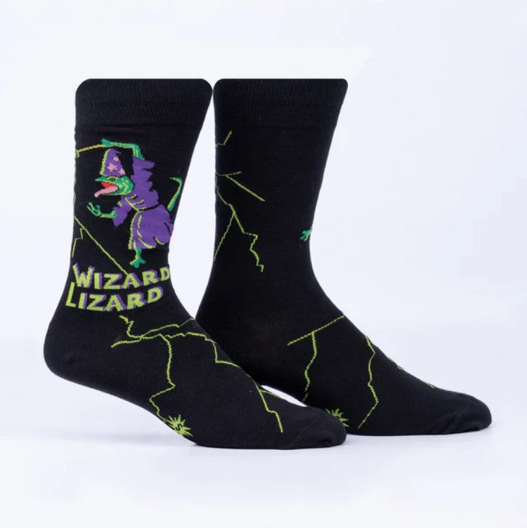 Black socks with a wizard lizard design on a white background