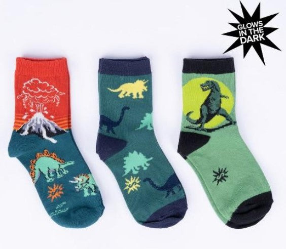 Set of Three glow-in-the-dark dinosaur-themed socks on a white background