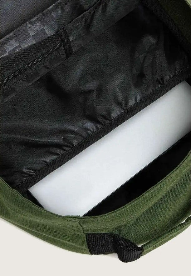 Green bag with a black checkered interior on a light gray background
