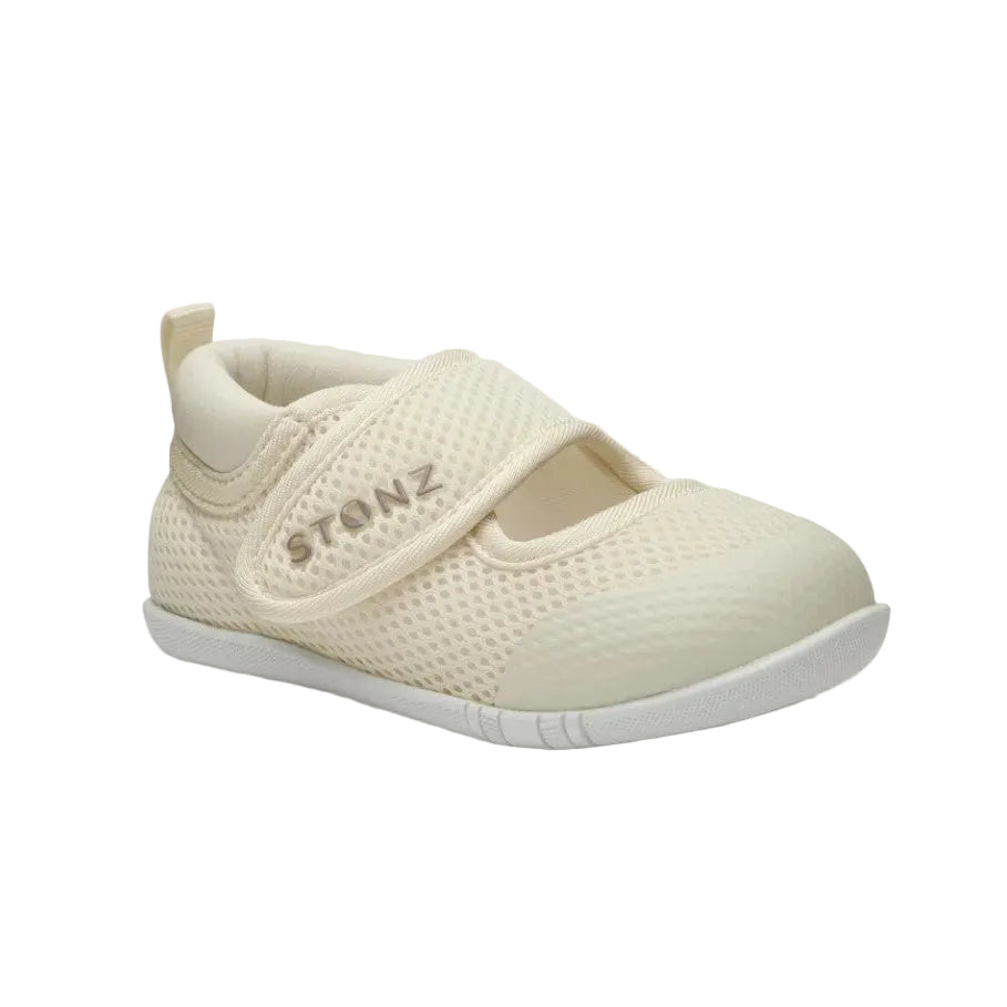 Beige shoe with a strap on a light gray background