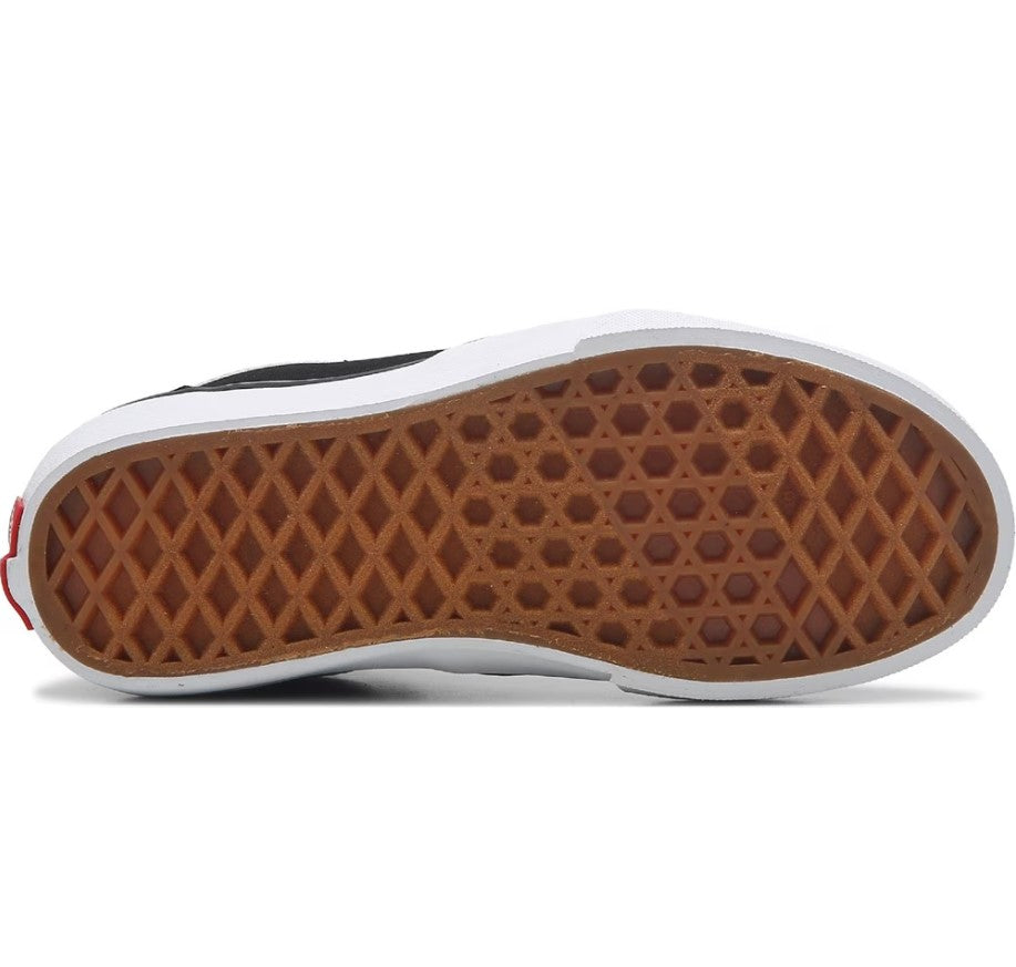 Close-up of a shoe sole with brown pattern on a white background