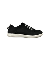 A black low cut slip in shoe with white elastic laces and a white sole