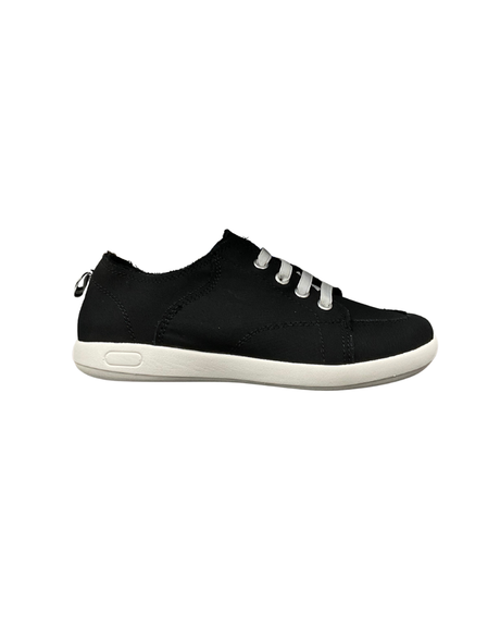 A black low cut slip in shoe with white elastic laces and a white sole