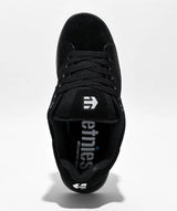 Black sneaker with a white brand logo on a white background